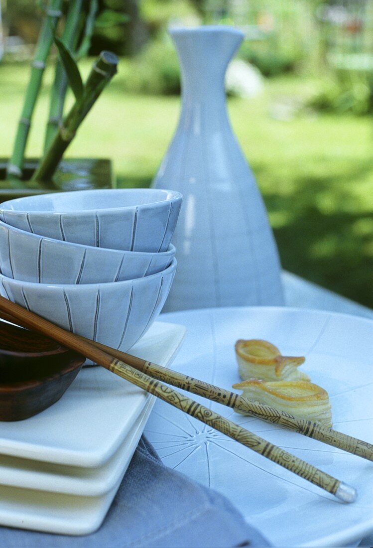 A table laid in Asian style in the open air