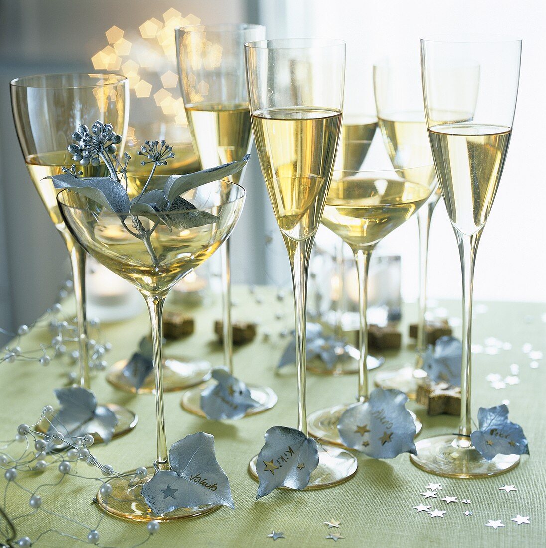 Champagne glasses on a table laid for Christmas