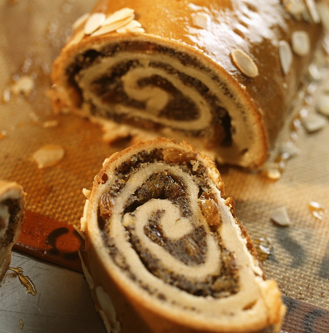 Poppy seed roll with a piece cut