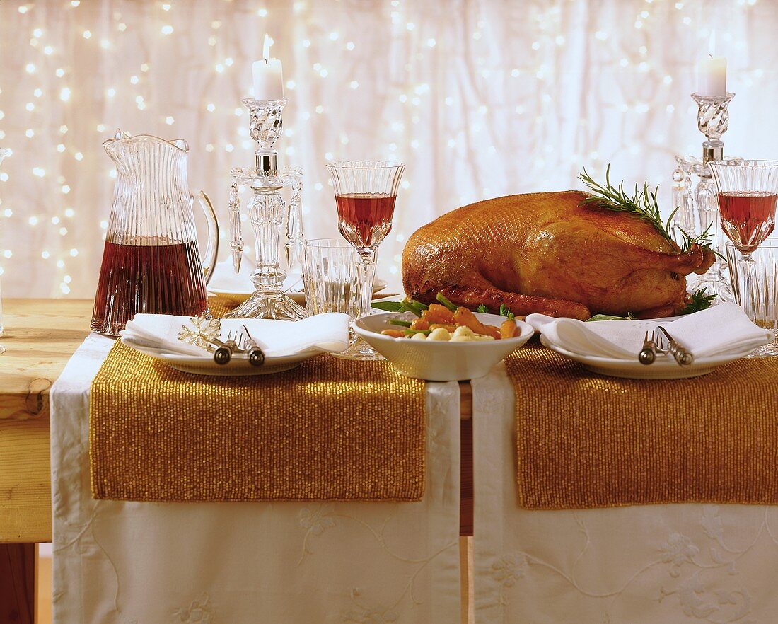 Roast goose on a table laid for Christmas