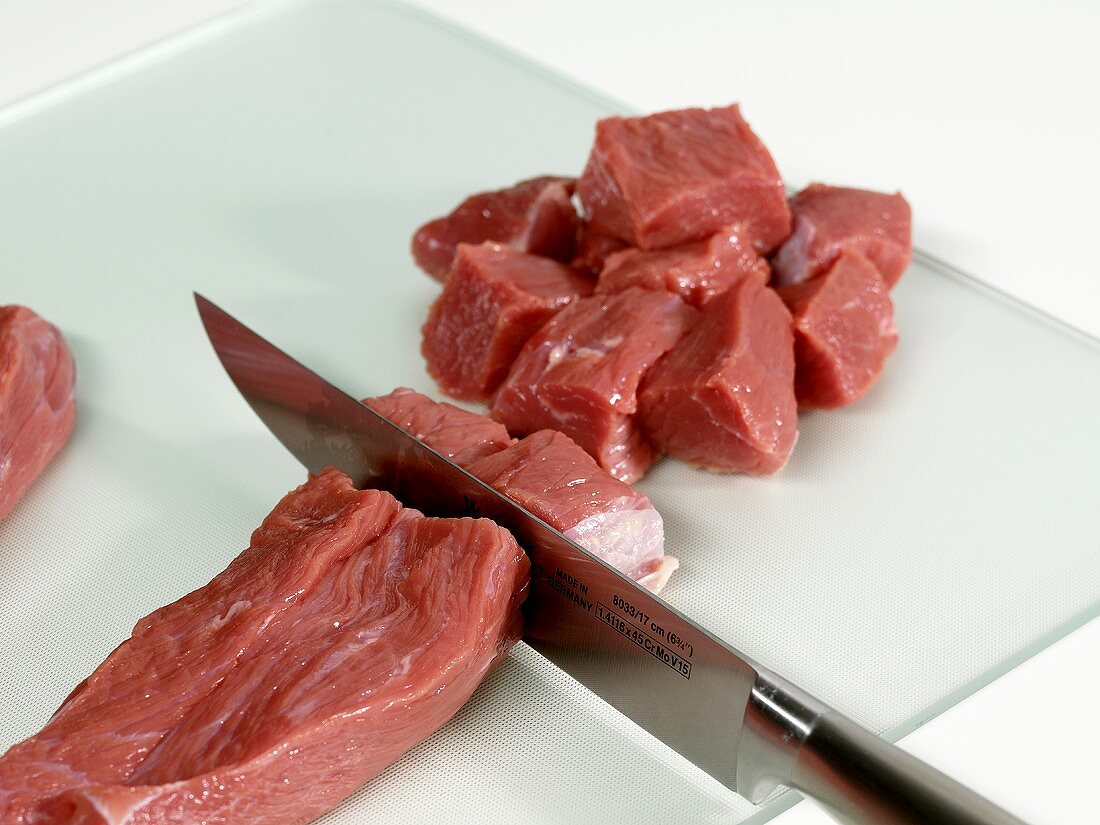Cutting veal goulash