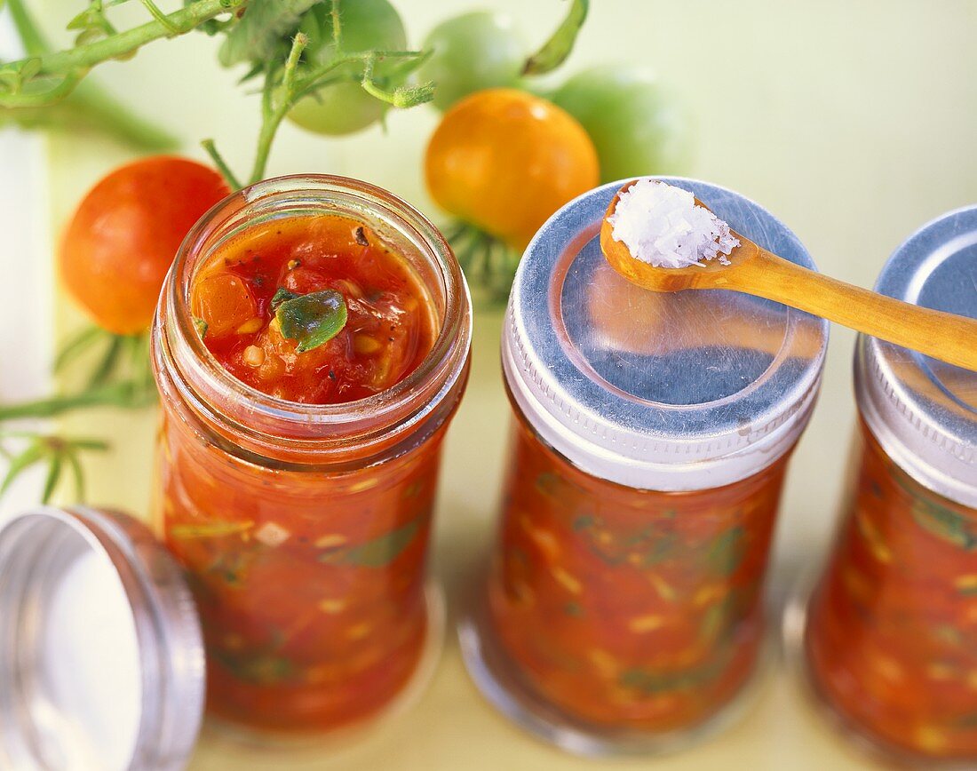 Tomato and herb sauce in screw top jars