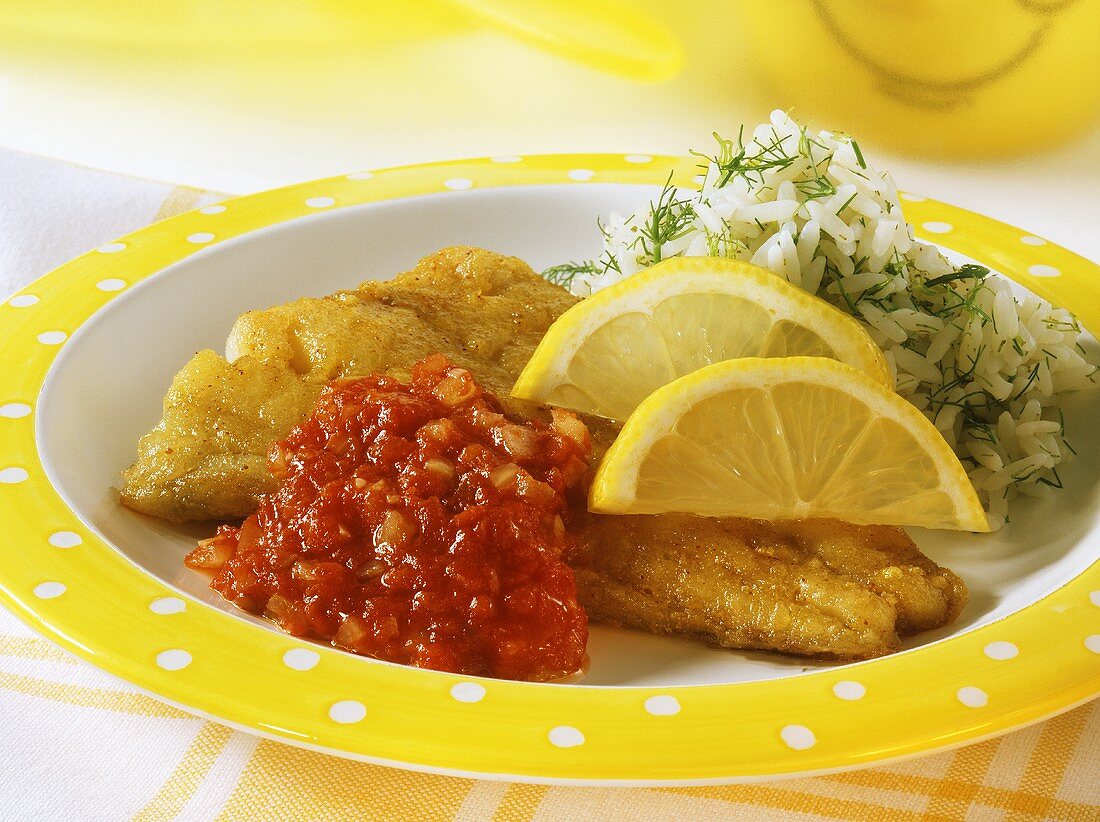 Breaded fish with spicy tomato sauce and herb rice