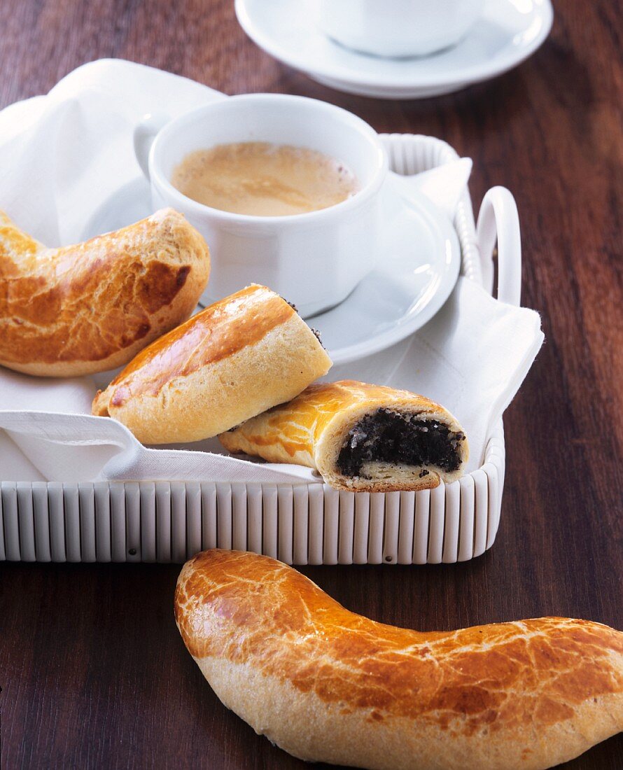 Mohnbeugel (poppy seed croissants) with coffee (Vienna, Austria)