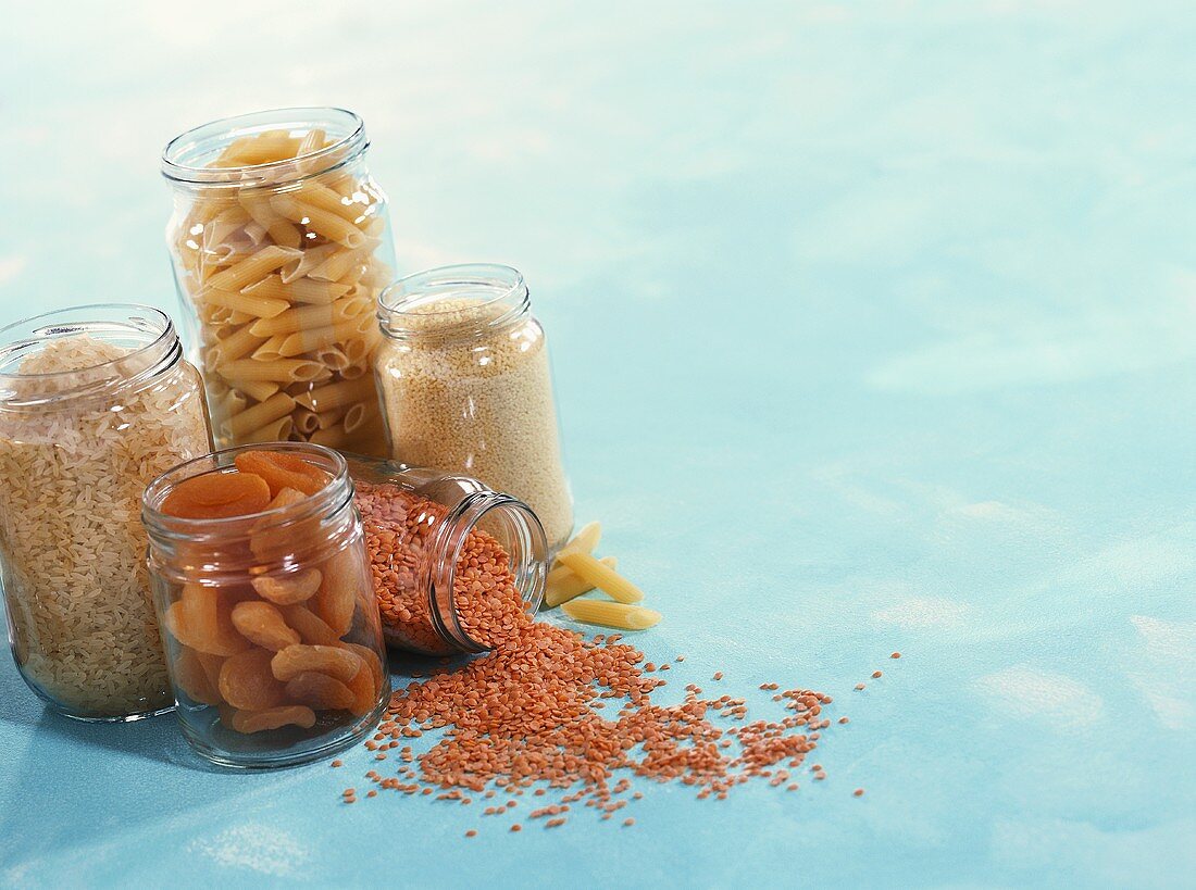 Noodles, rice, lentils and dried apricots in jars