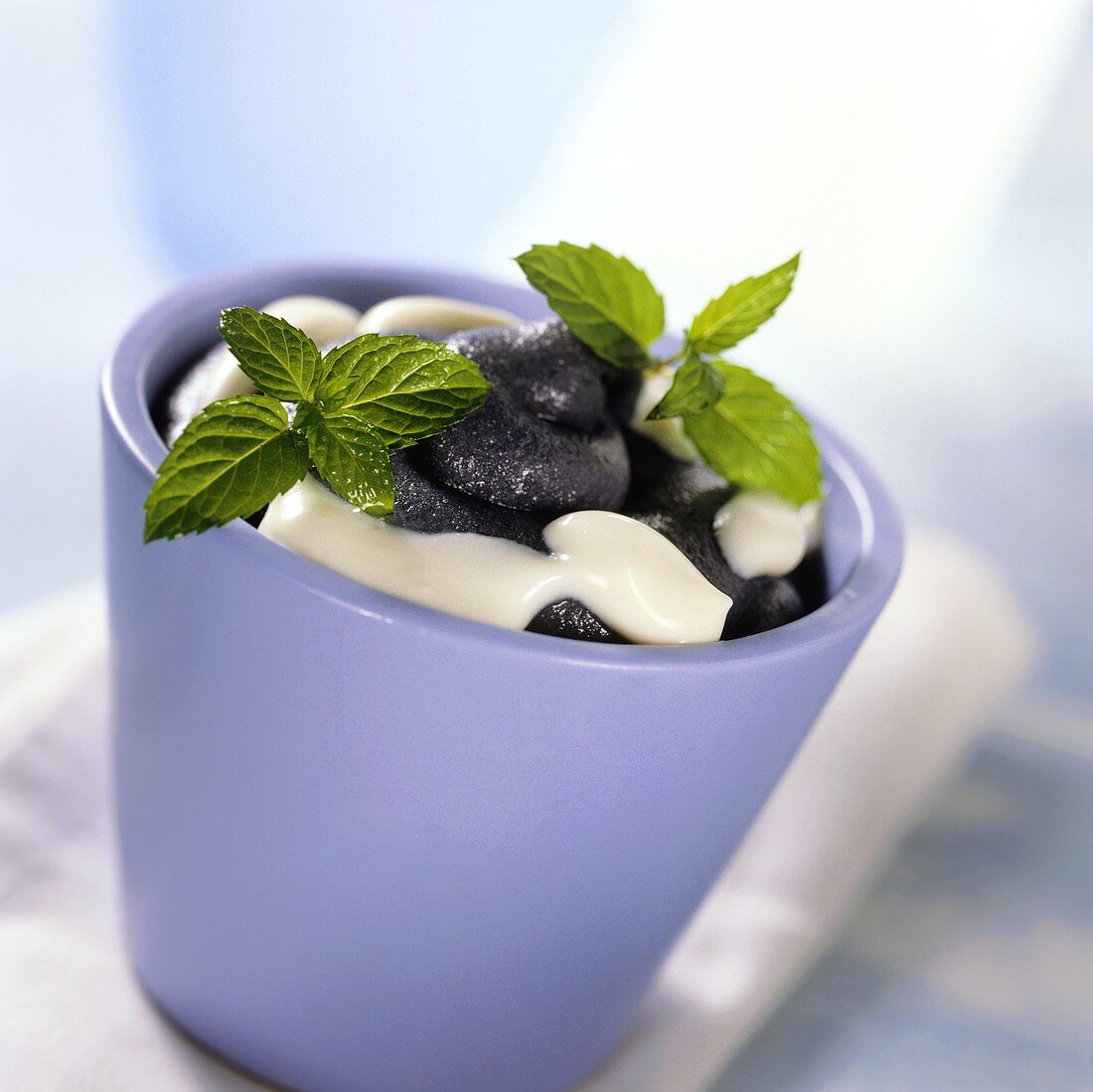 Blueberry sorbet with cream and mint