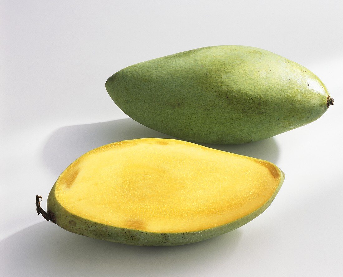 Mangos, variety 'Nam Dok Mai', whole and halved