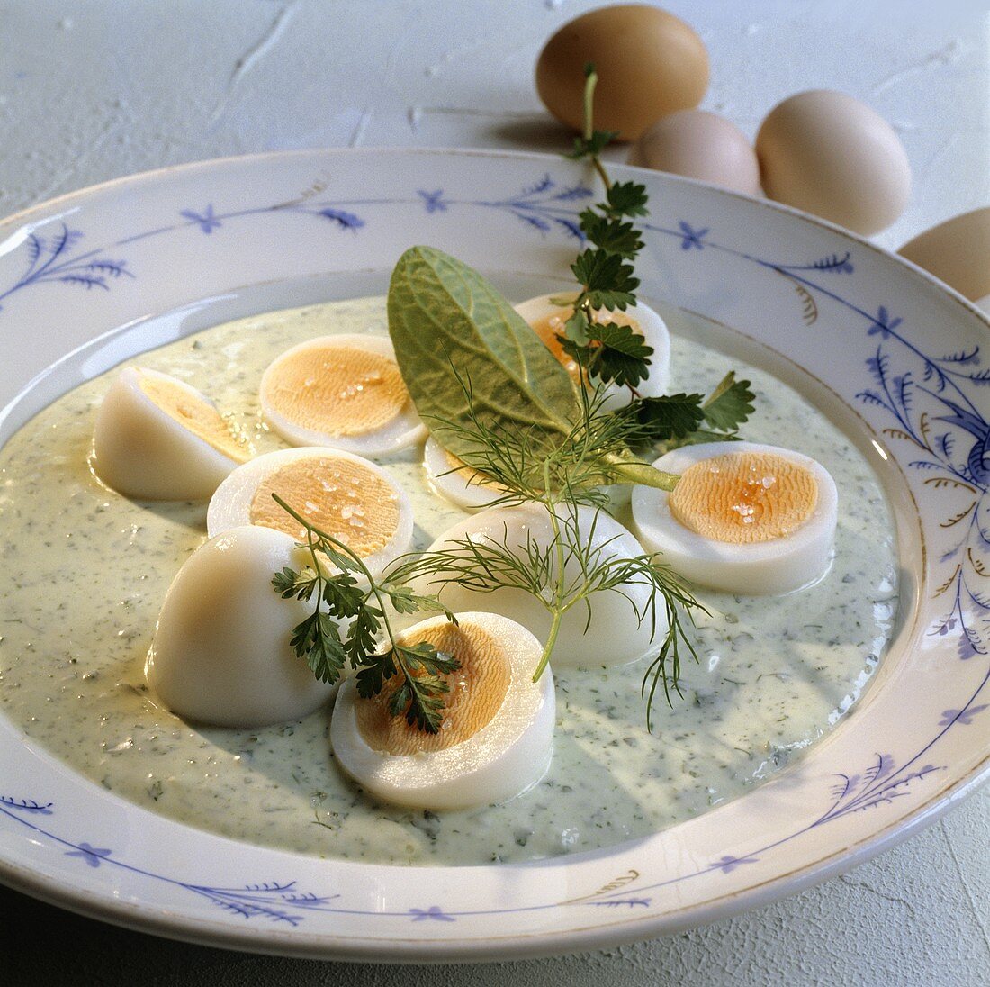 Boiled eggs in green sauce