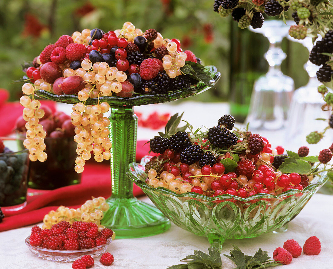 Assorted berries in green bowls
