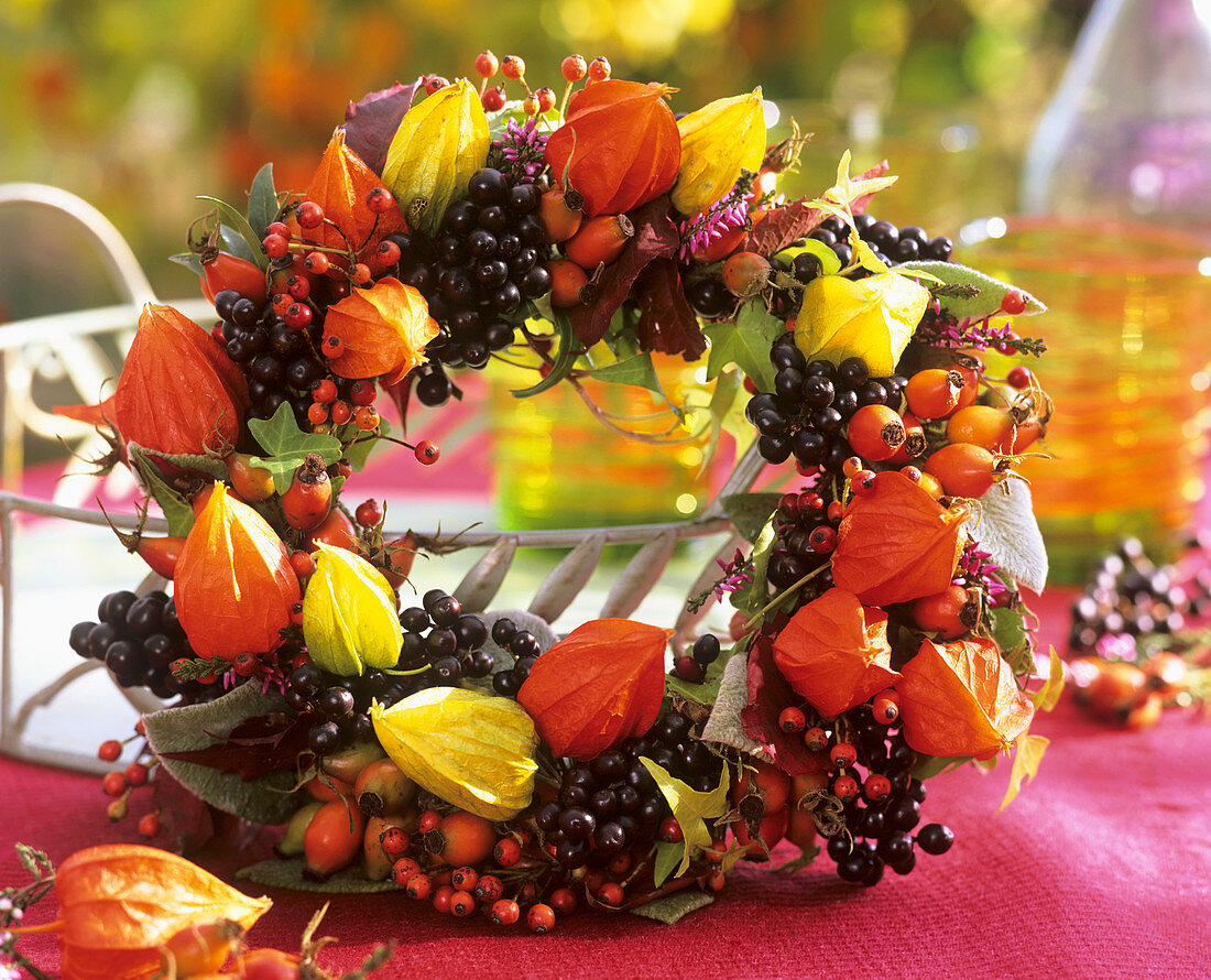 Wreath of privet berries, rose hips and Physalis