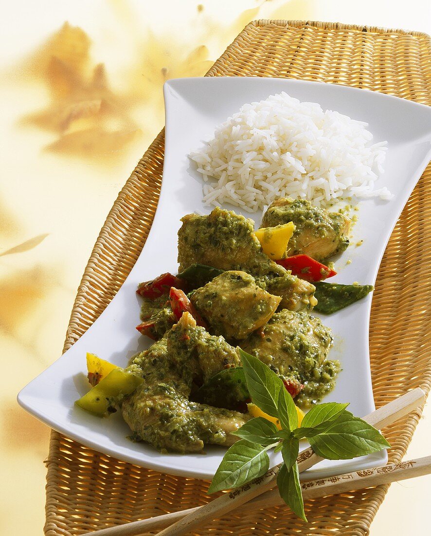 Curried chicken with Thai basil, peppers and rice