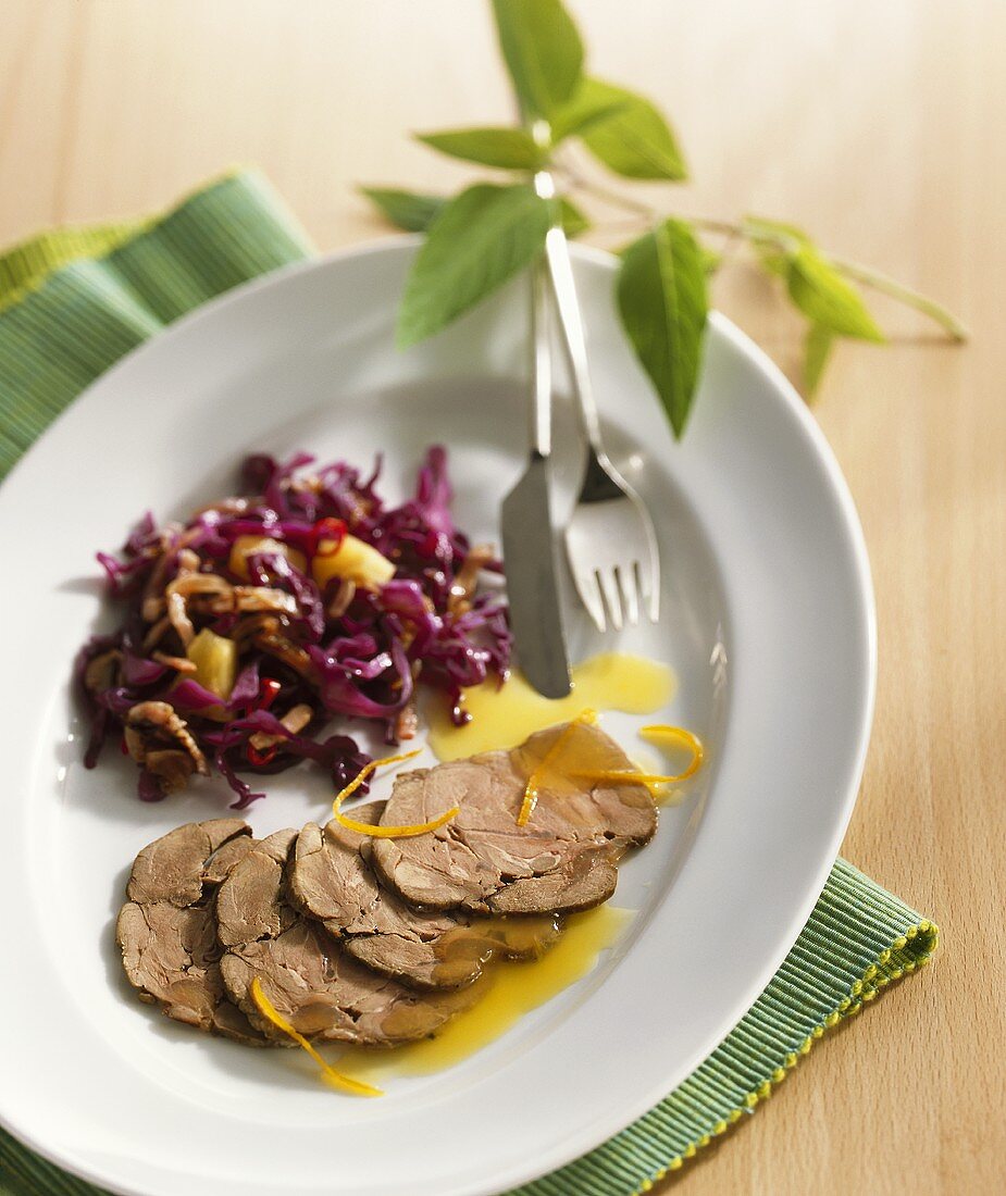 Roast venison with red cabbage and pineapple salad