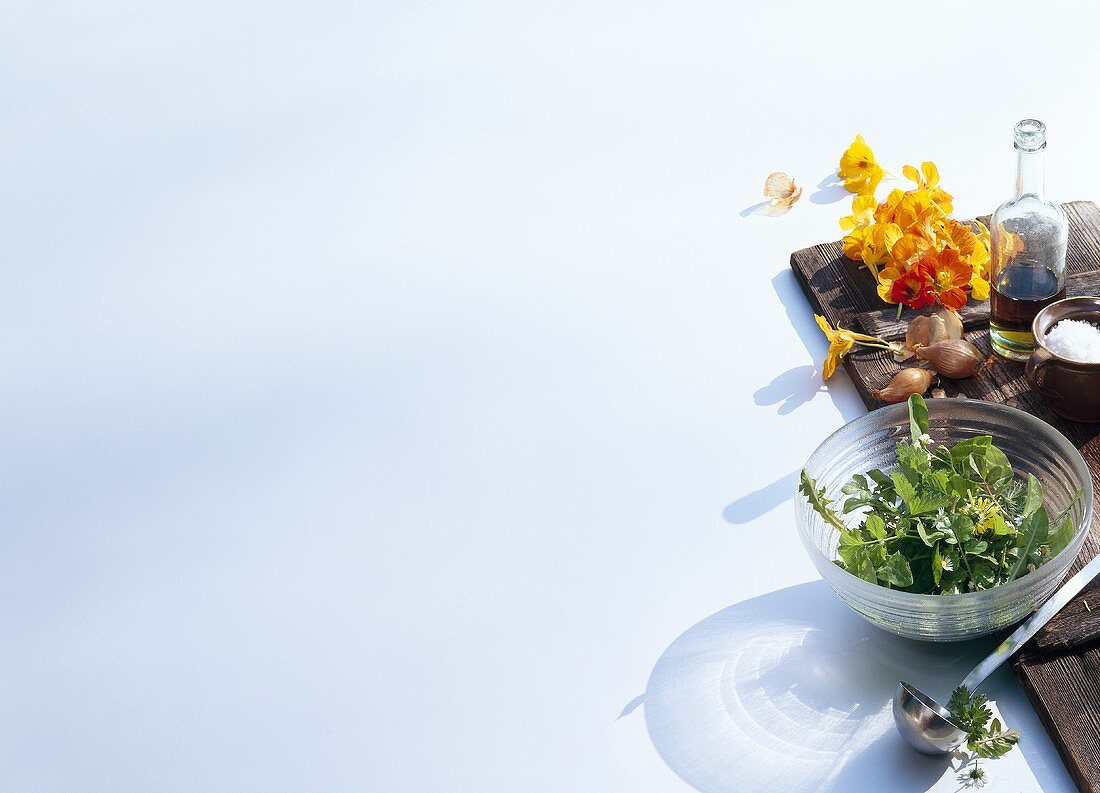 Wild herbs, nasturtium flowers and shallots