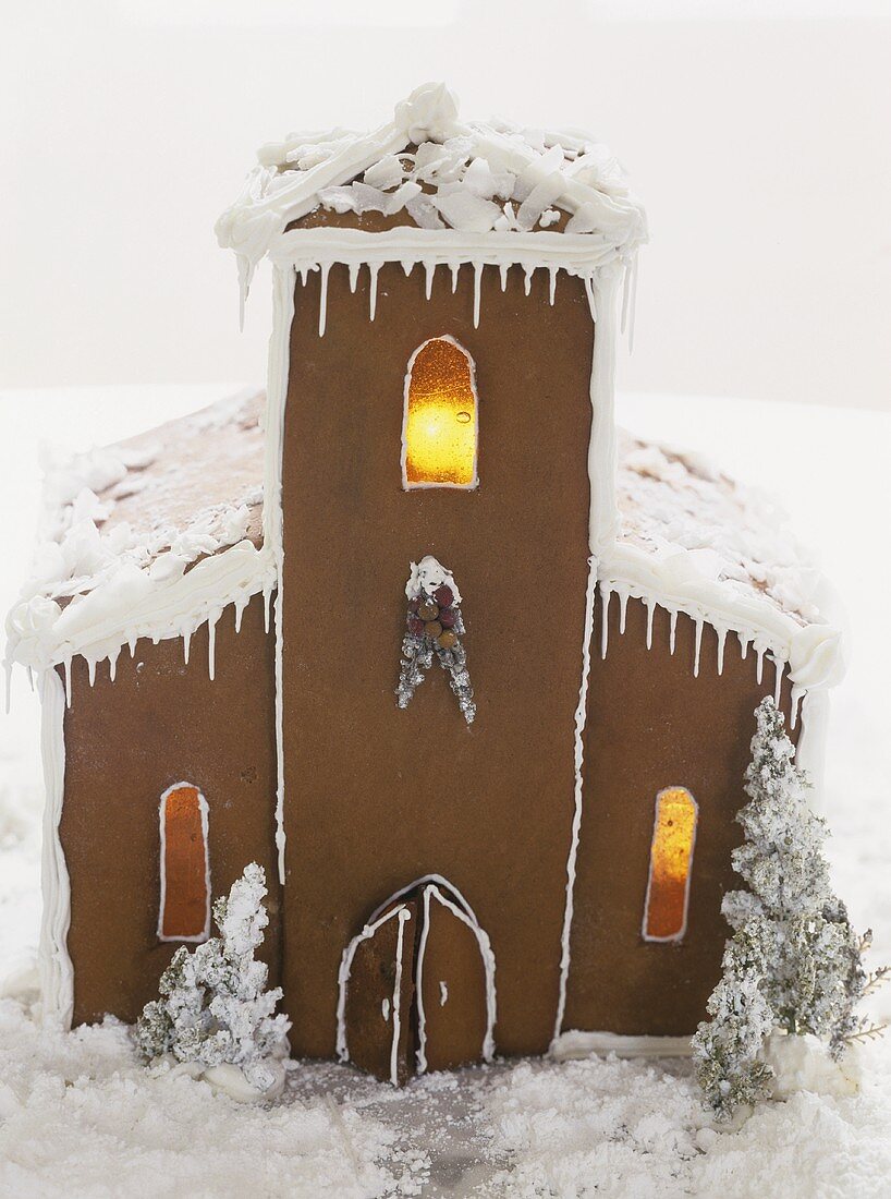 A gingerbread house, lit from inside