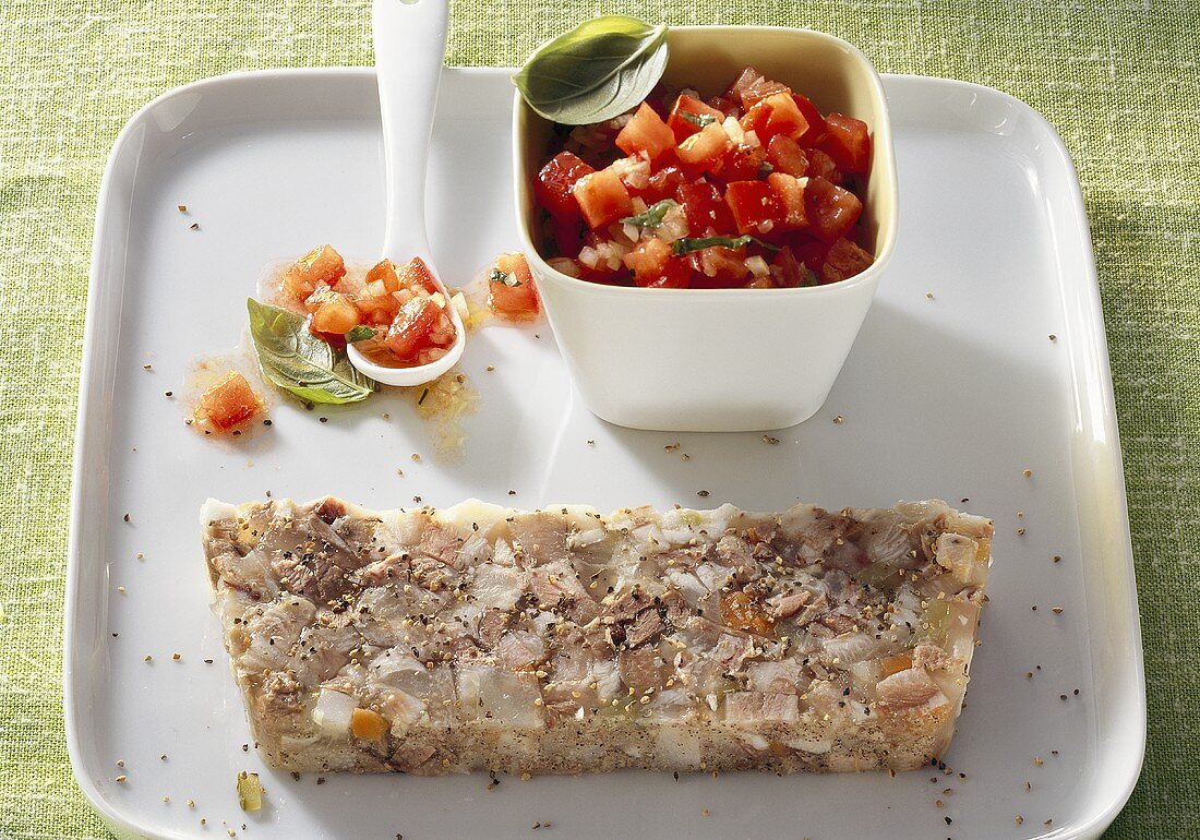 Bavarian Knöcherlsulz (jellied pork dish) with tomato salad