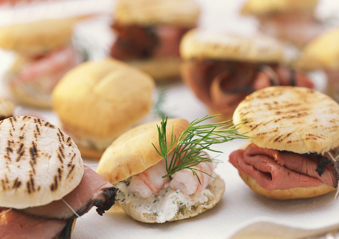 Several filled party rolls with shrimps, roast beef