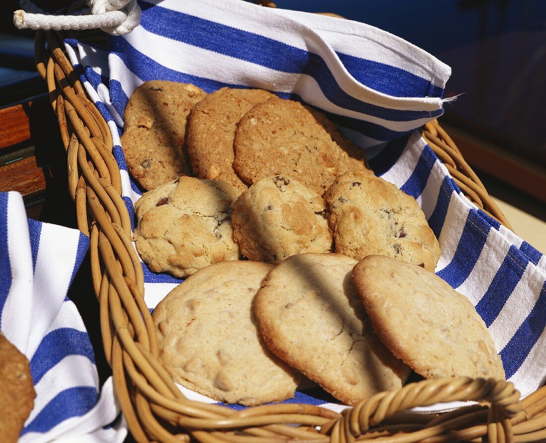 Assorted round cookies in straw basket on boat