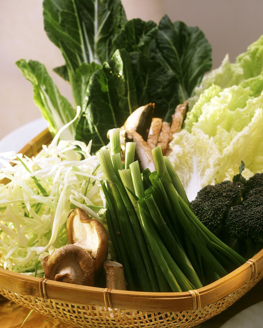Various types of cabbage, spring onions & mushrooms