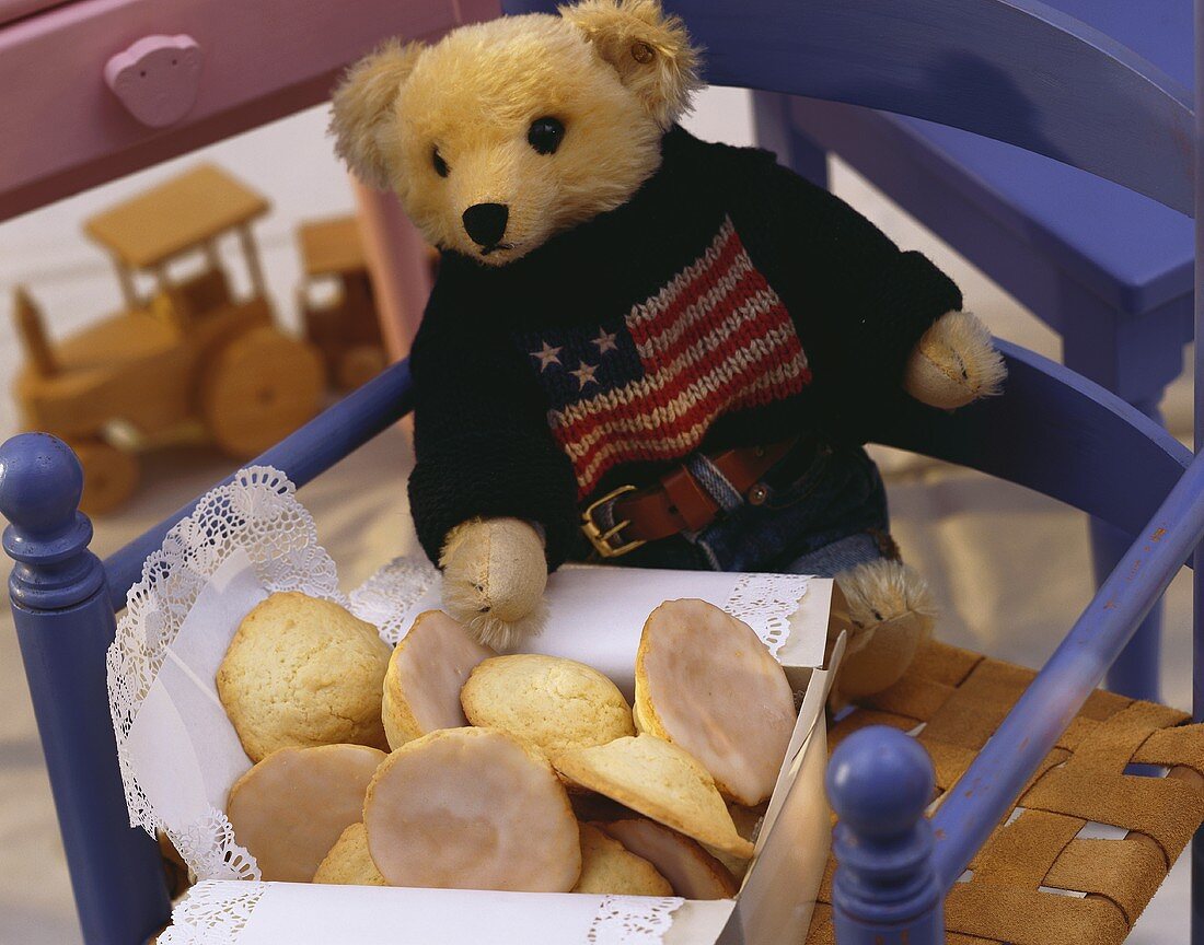 Amerikaner (round iced biscuits) and teddy bear