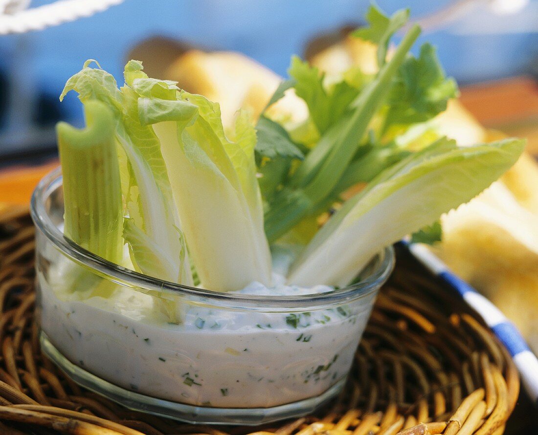 Celery Sticks in a Bowl of Vegetable Dip