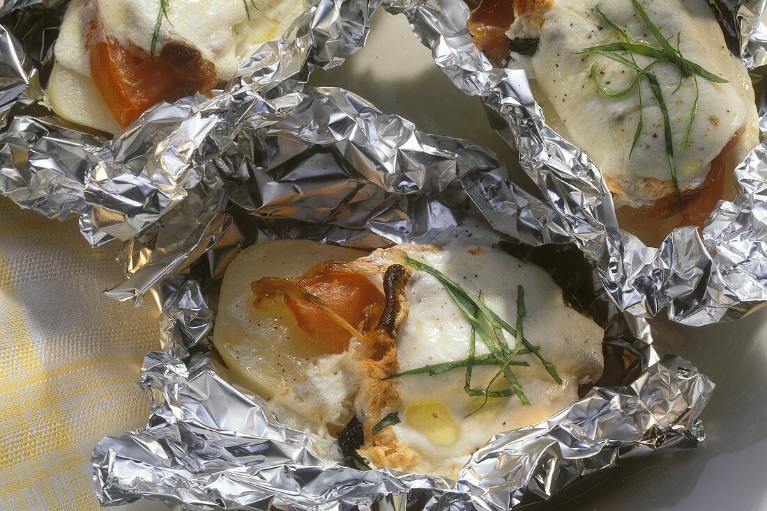 Potatoes Stuffed with Mozzarella; Tomatoes and Parmesan