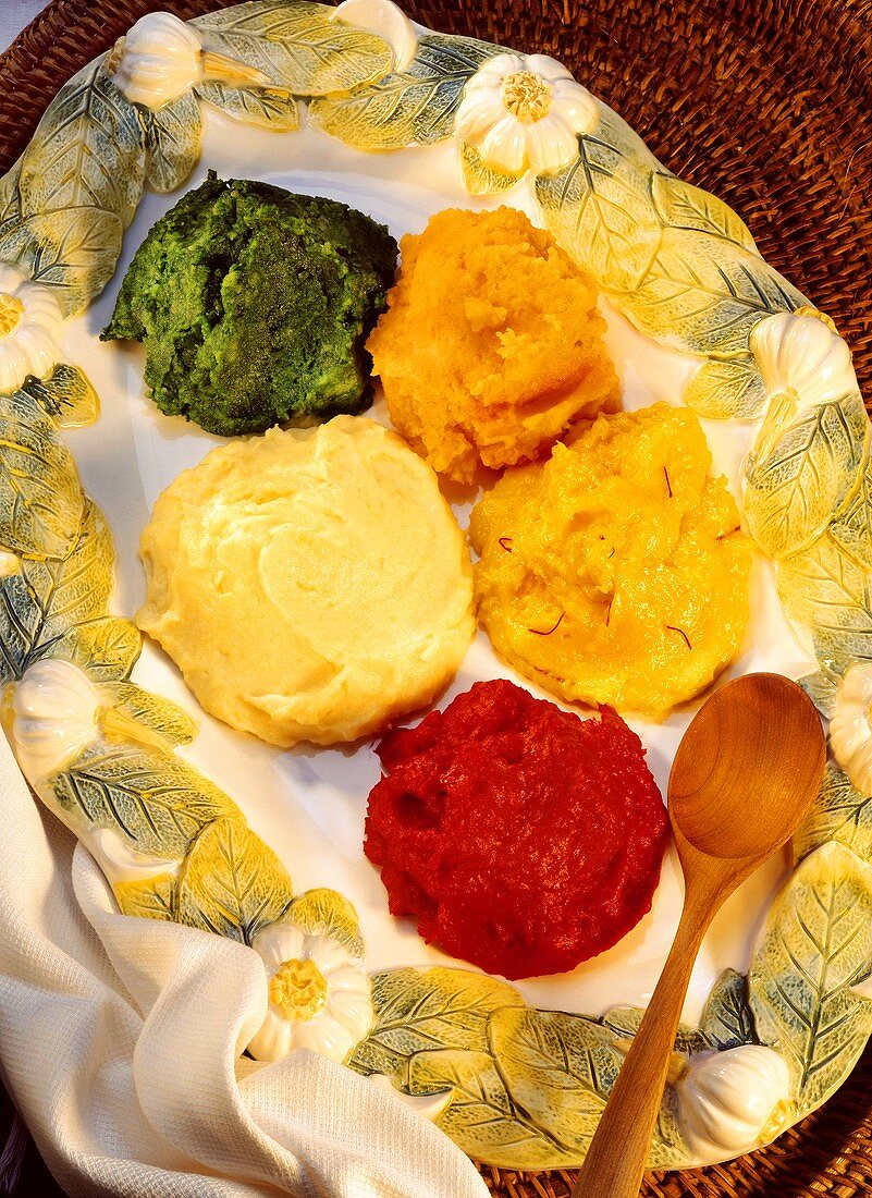 Mashed potato coloured with saffron, carrots, spinach, beetroot