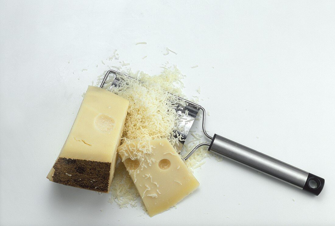 Emmental cheese in two pieces & grated with cheese grater