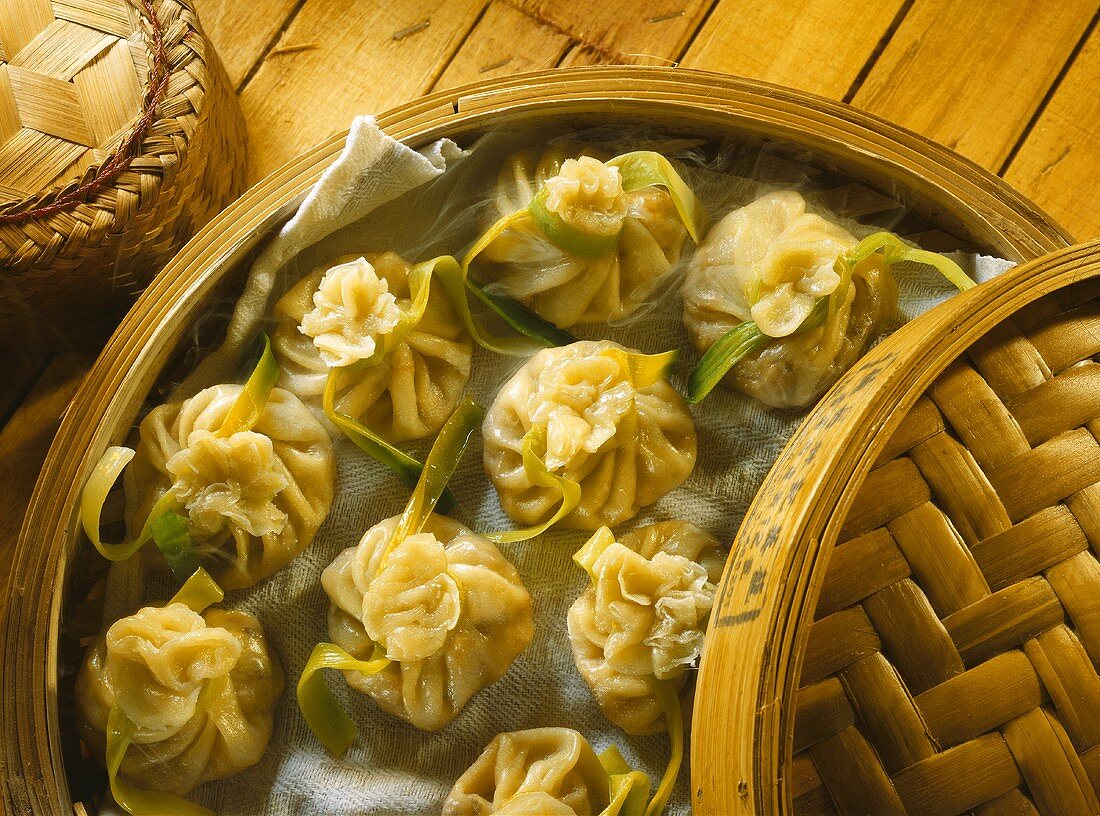 Pasta parcels with shrimp filling in bamboo steamer