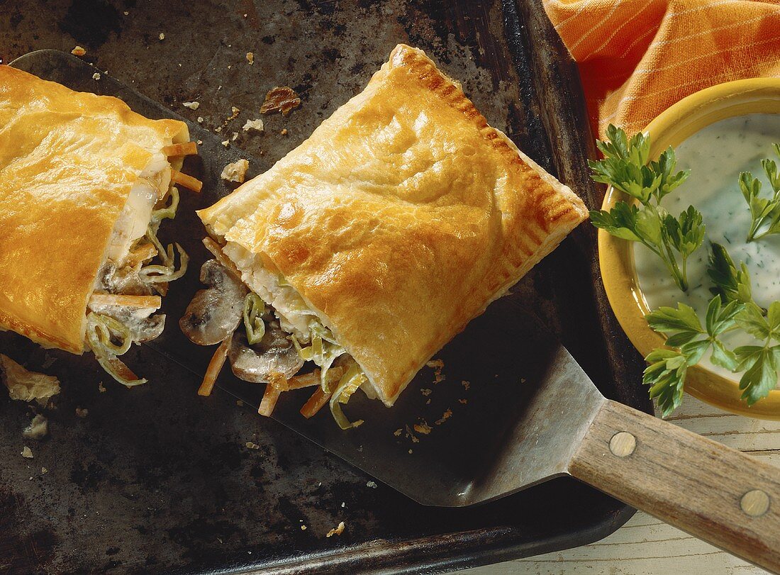 Brook trout with brown mushrooms & vegetables in puff pastry