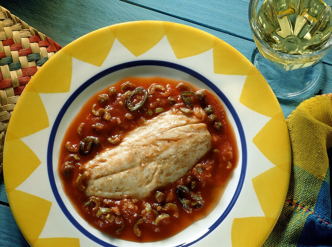 Red snapper with tomatoes, olives and peppers