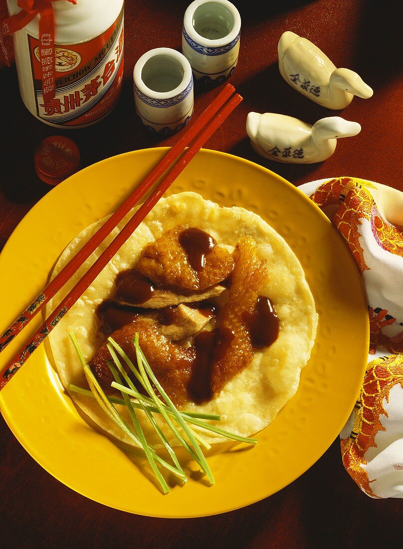 Peking duck on flatbread with spring onions & soya paste