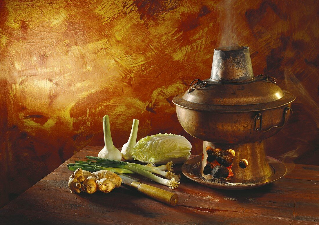 Chinese fondue with various vegetables and ginger