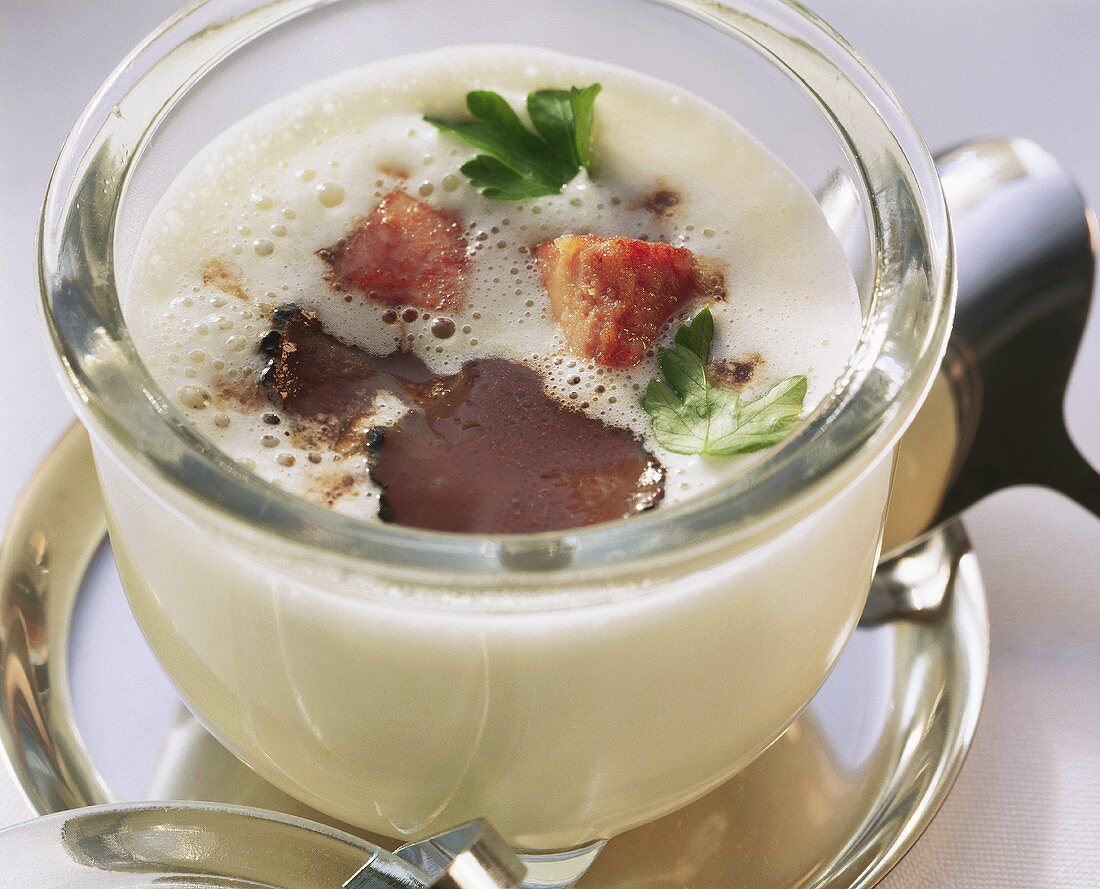 Truffle and potato soup in glass