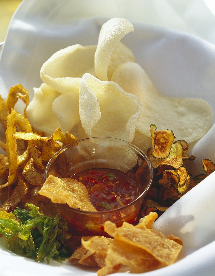 Fried vegetable crisps & prawn crackers with spicy sauce