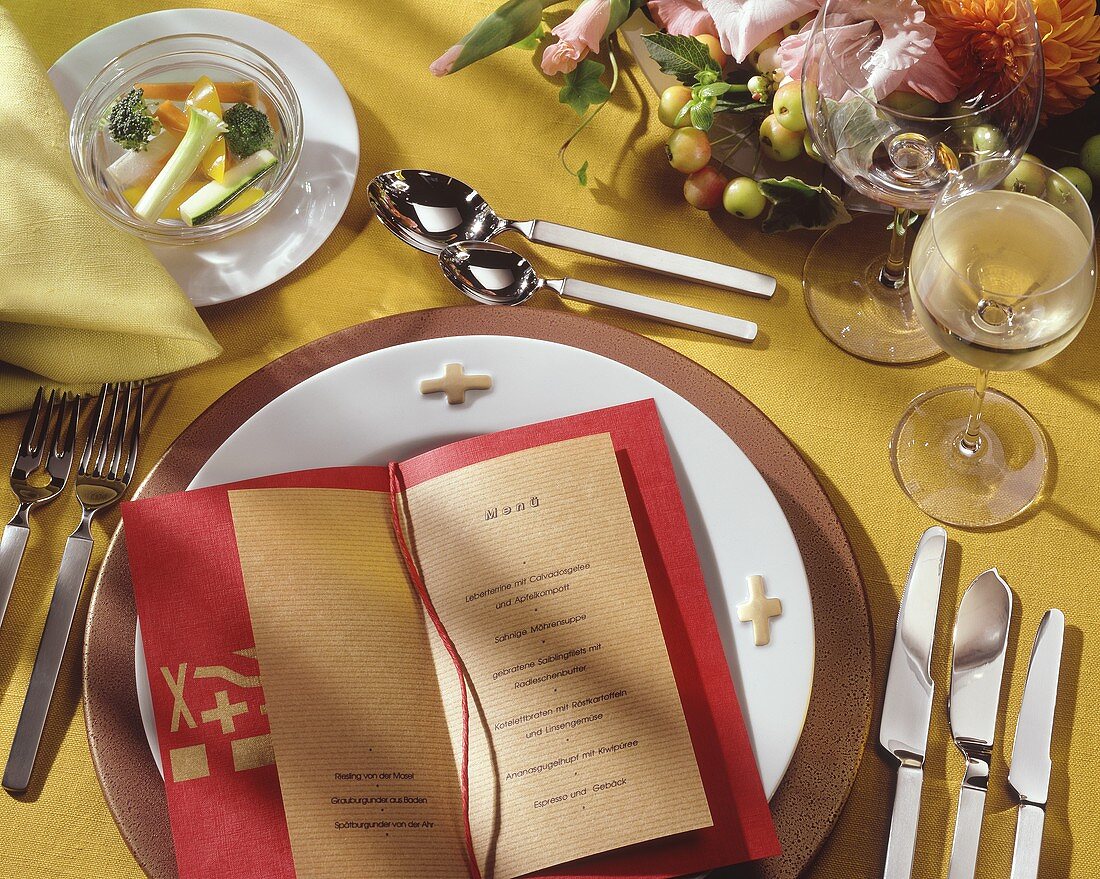 Place setting with menu for five-course meal