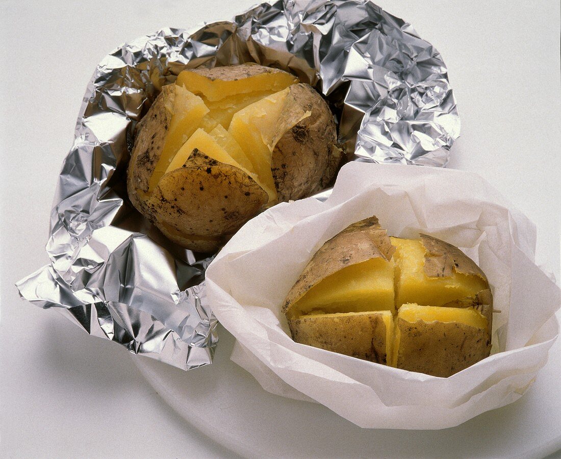 Potatoes in foil and greaseproof paper