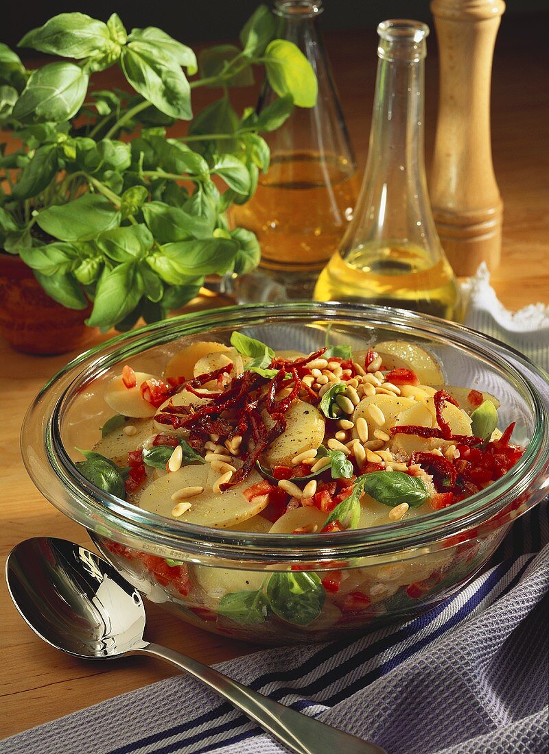 Potato salad with tomatoes, pine nuts & basil