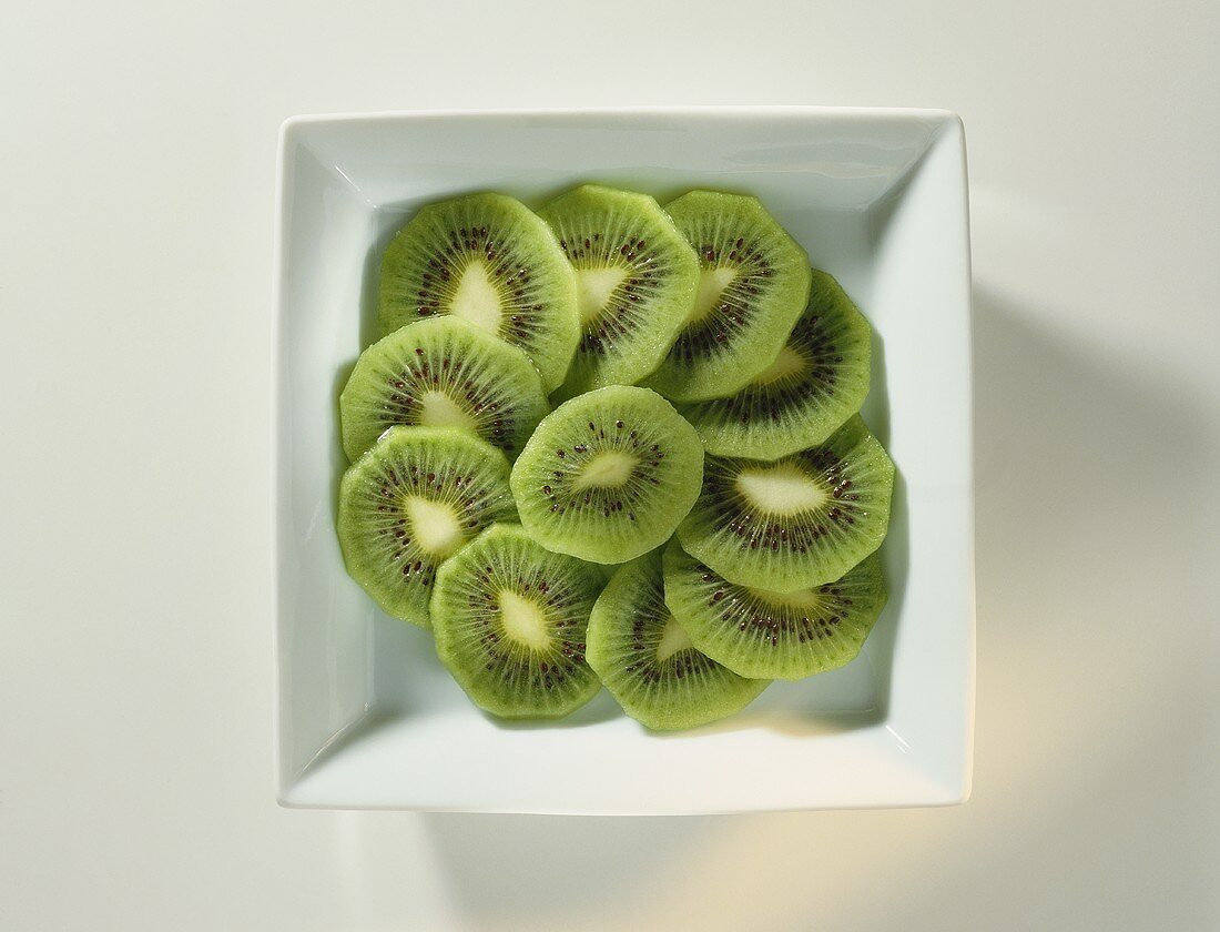 Sliced Kiwi in a White Dish