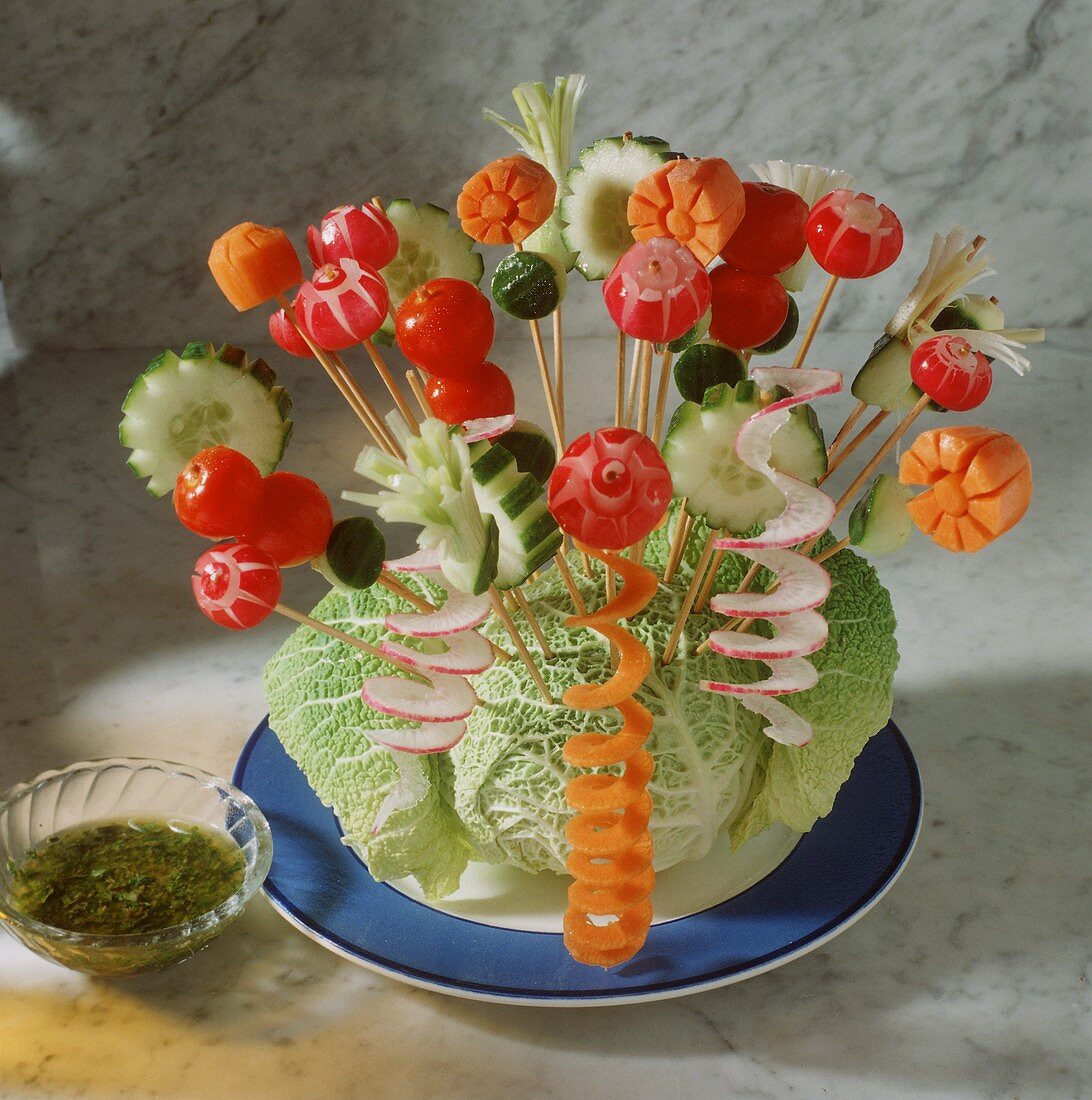 Raw vegetable kebabs on savoy cabbage