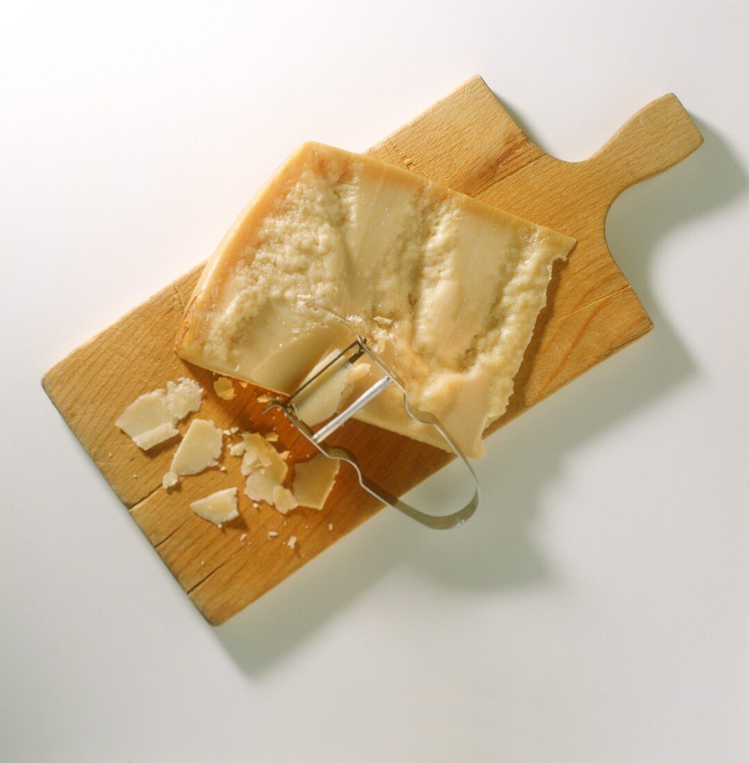 Parmesan Cheese on a Cutting Board