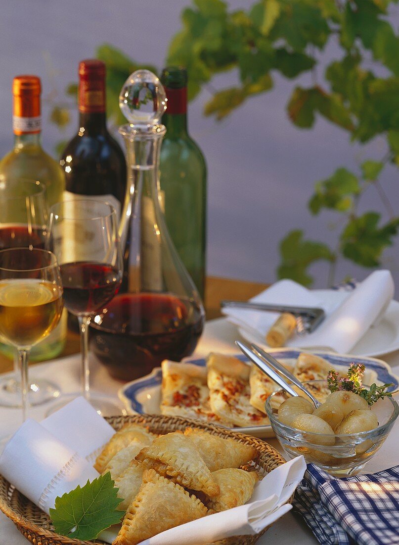 Laid table with various appetisers & wine