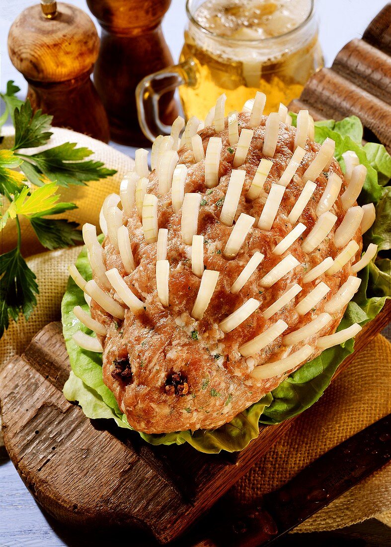 Hedgehog made from raw mince with onion pieces