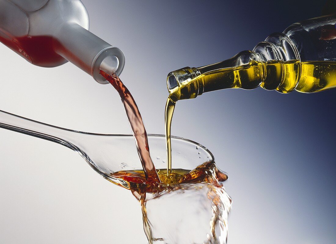 Oil and Vinegar Pouring into a Spoon