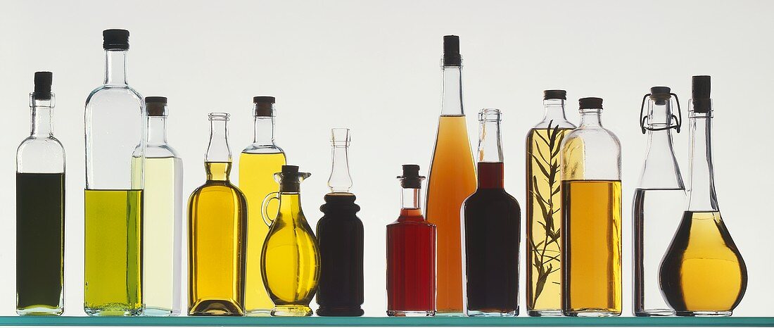 Several Oils and Vinegars in Glass Bottles