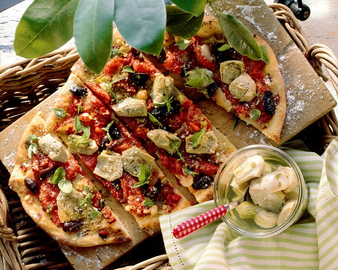 Pizza ai carciofi (Artichoke pizza with olives and oregano)