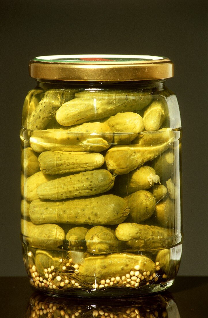 Glass of pickled gherkins