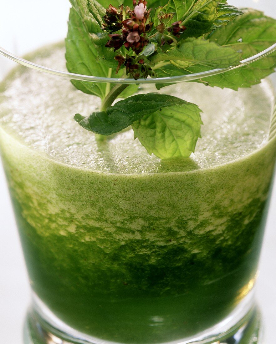 Radish and herb cocktail with mint leaves and flowers