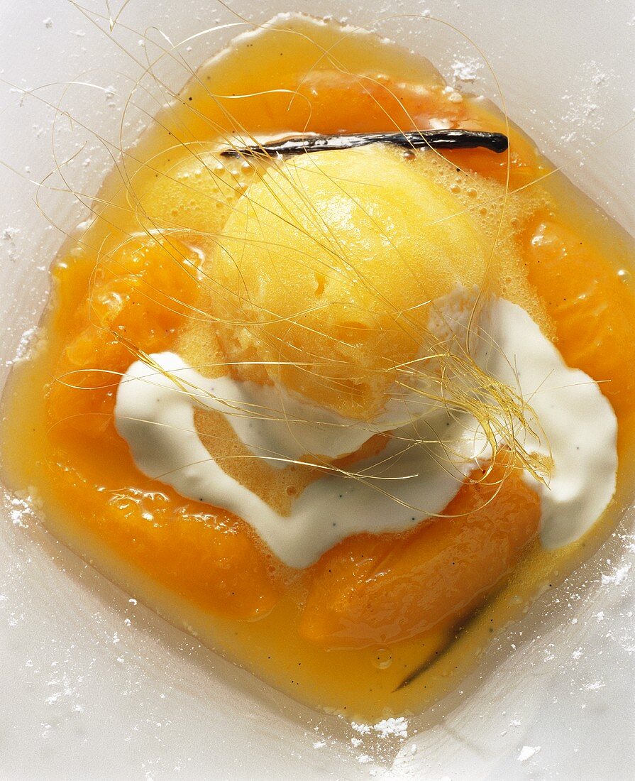 Apricot ice cream on apricot compote with cream & spun sugar