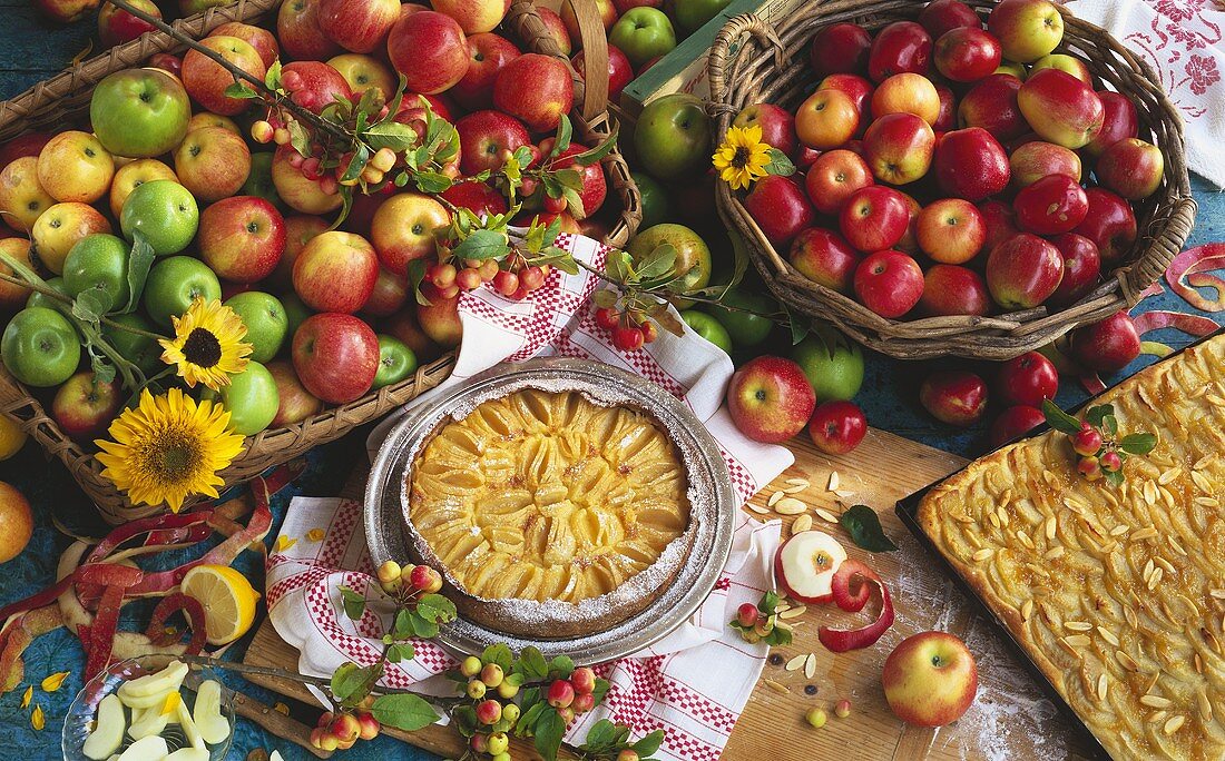 Apple tart & apple cake with almonds & two baskets of apples