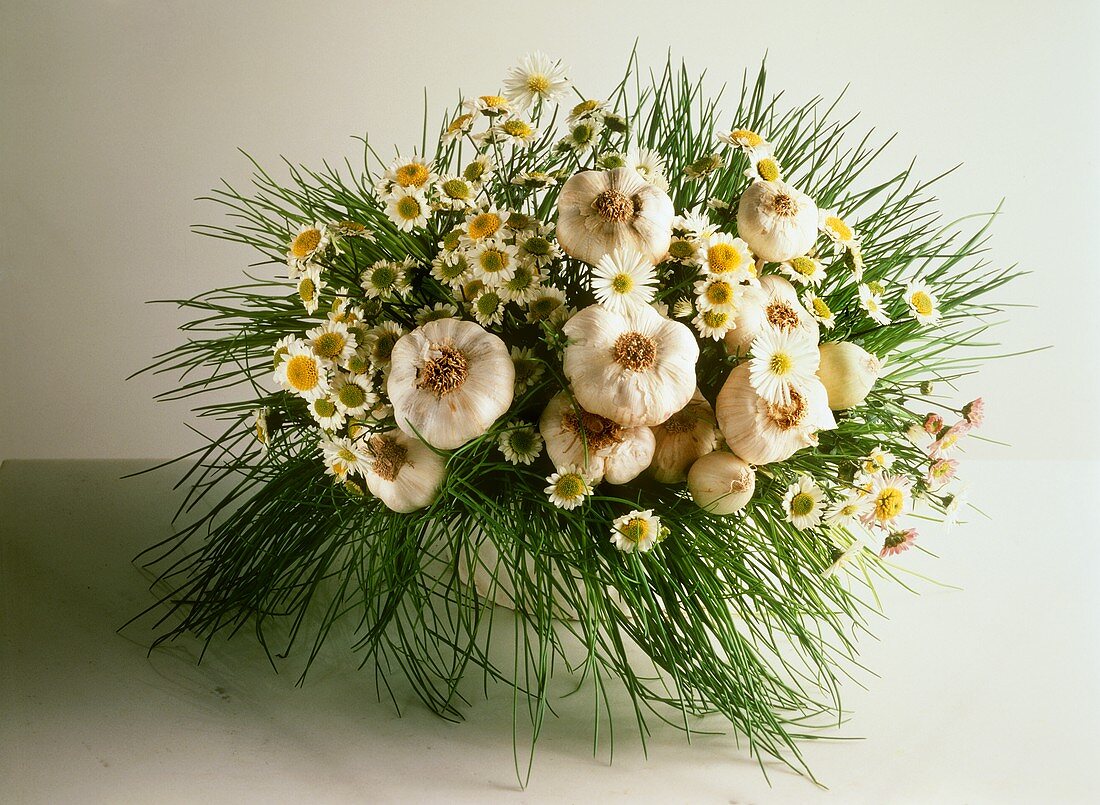 Vegetable bouquet of garlic, chives and daisies